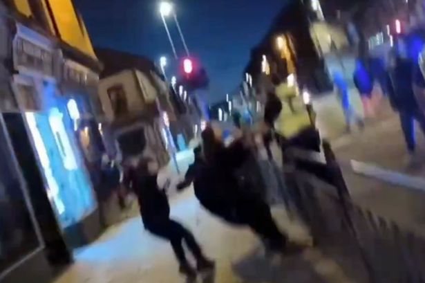 Police clash with anti-migrant protesters in Glasgow as roads closed